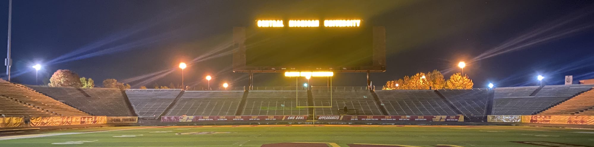 empty football stadium at night under the lights Buffalo