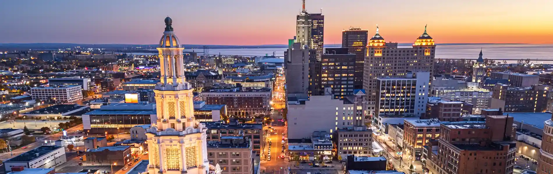 Neon color image of a band playing and people singing along